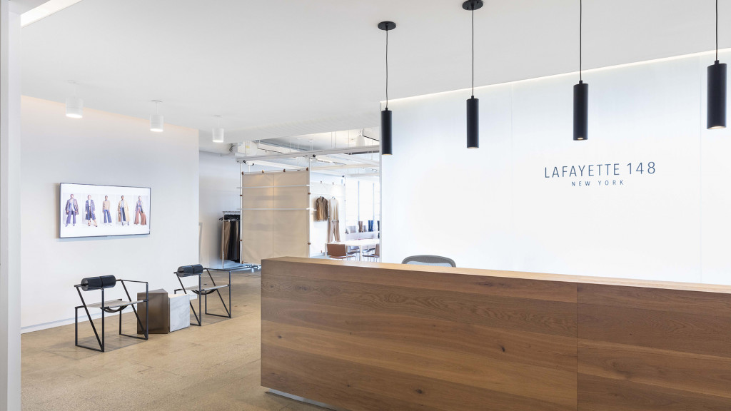 A room with a white board and chairs.